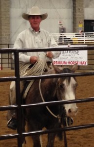Joe Wolter works a green horse and talks with spectators at the Utah Horse Expo